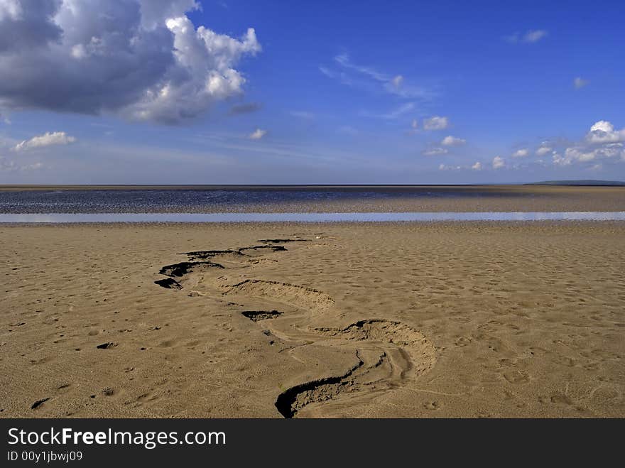 Sand at low tide in the Morcambe Bay estuary at low tide. Sand at low tide in the Morcambe Bay estuary at low tide