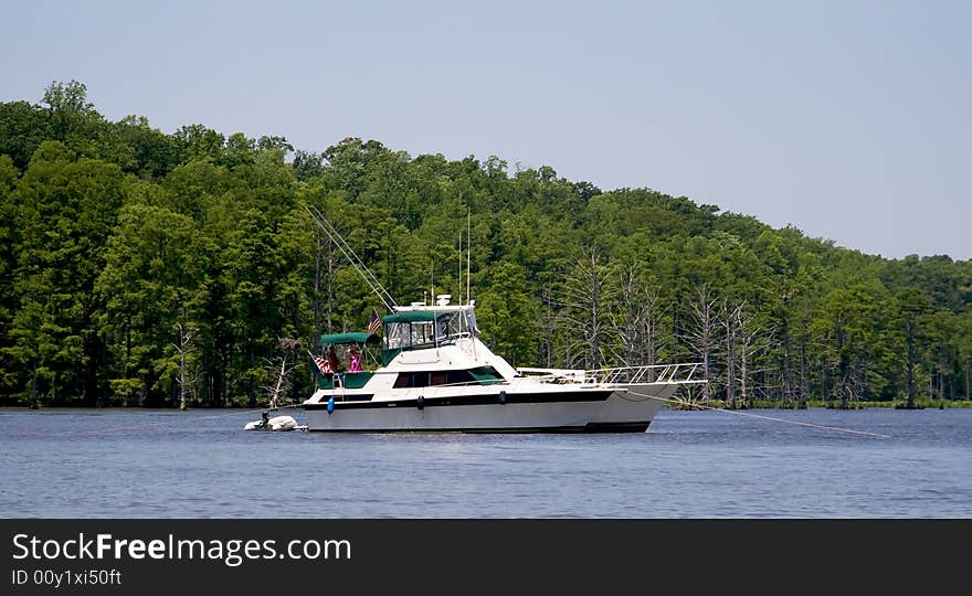 Two yachts anchored in a river. Two yachts anchored in a river.