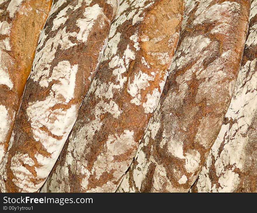 Brown bread round loafs background. Brown bread round loafs background