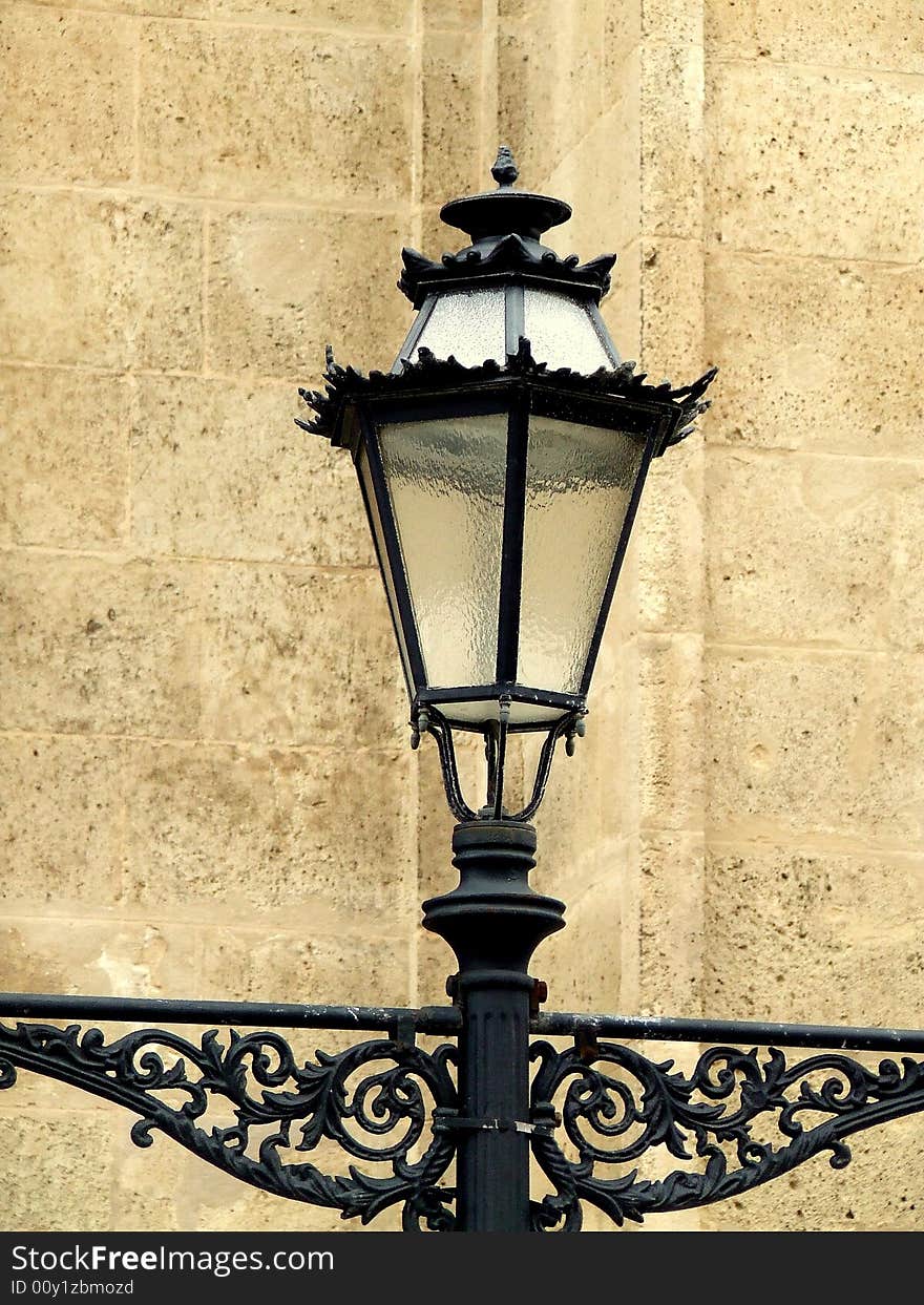 Old lamp and brick wall at Maillorca, Spain