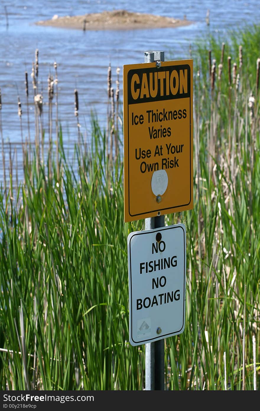 Warning signs in marsh