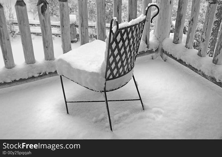 Heavy Snow on Metal Deck Chair. Heavy Snow on Metal Deck Chair