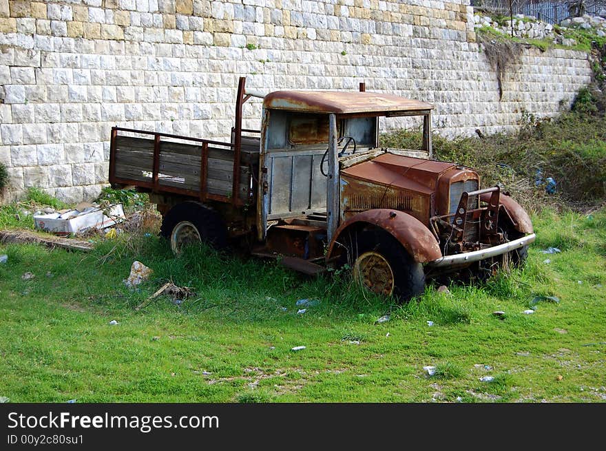 Old abandoned truck in the grass. Old abandoned truck in the grass.