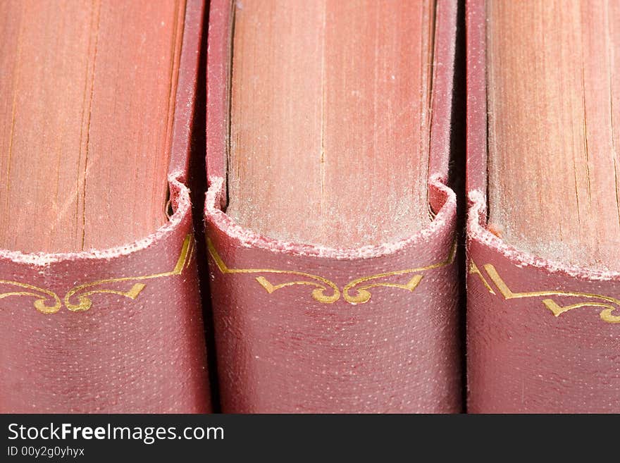 A row of very old dusty books- close up. A row of very old dusty books- close up