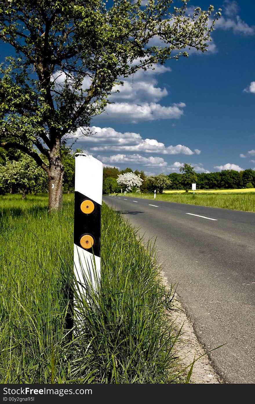 Lonely country road in the franconian country side in germany. Lonely country road in the franconian country side in germany