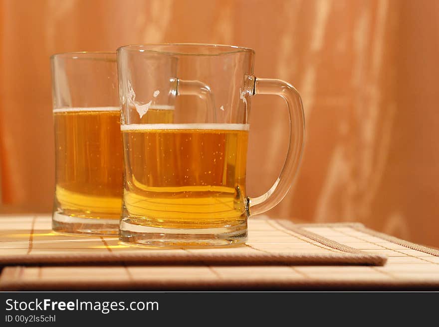 Friendly party around a beer mug. Friendly party around a beer mug