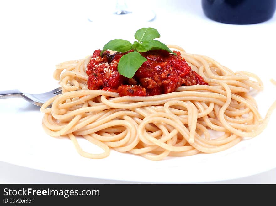 Spaghetti bolognese served on white plate. Spaghetti bolognese served on white plate