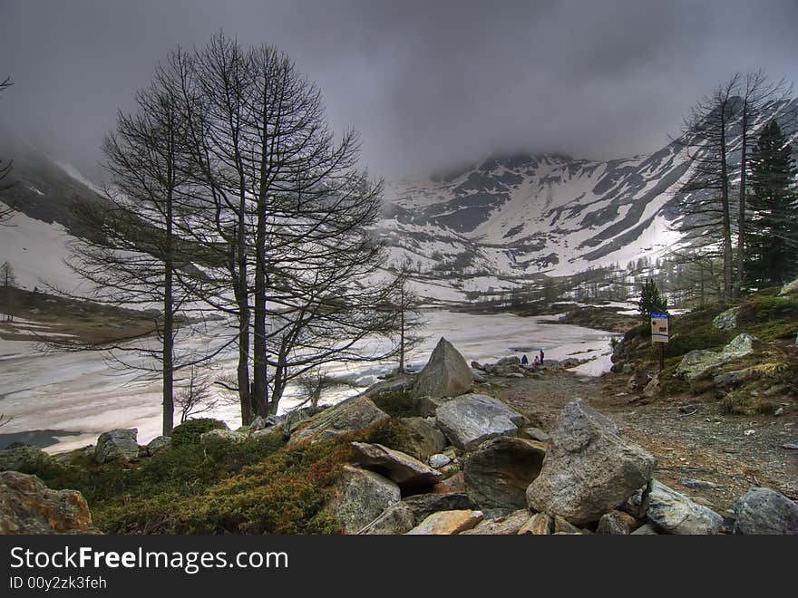 Apry lake with snow and clouds