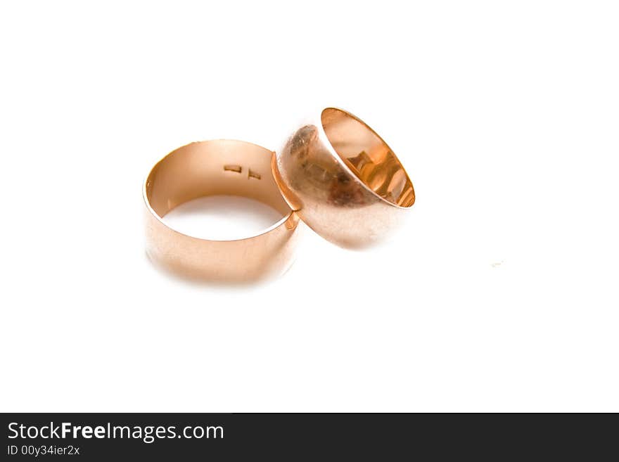 Golden wedding rings isolated on white. Golden wedding rings isolated on white