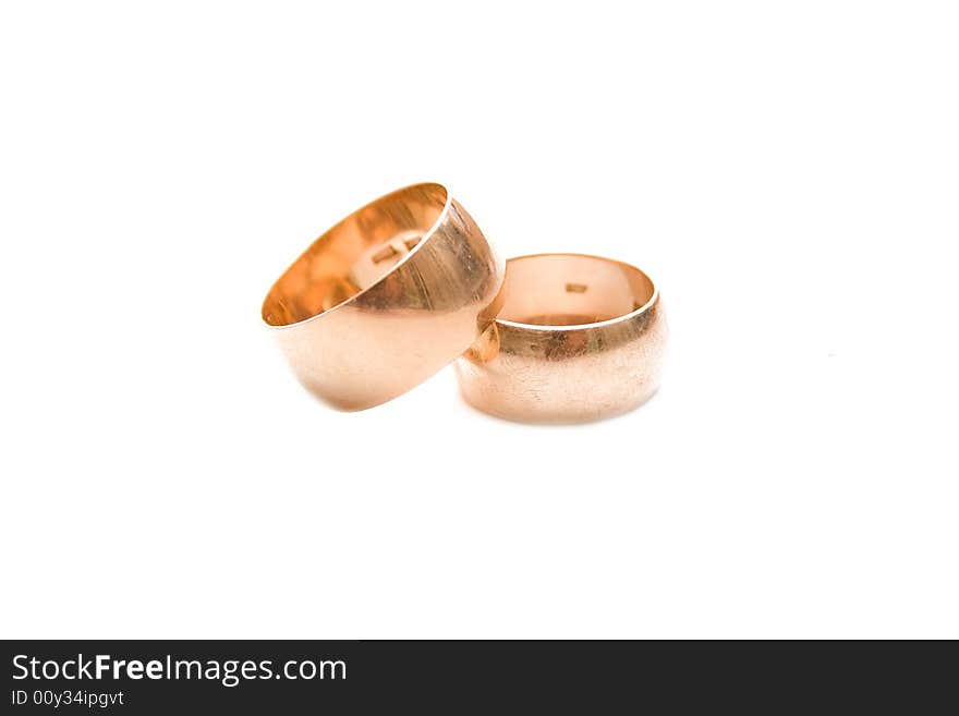 Golden wedding rings isolated on white. Golden wedding rings isolated on white