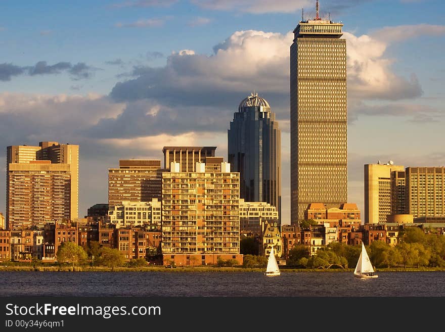 A couple of sailboats on the Charles River in the late afternoon near Boston's Back Bay.