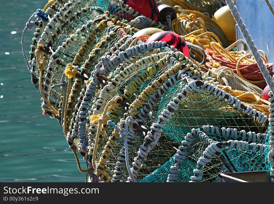 Fishing baskets attached to a fishing vessel in Kalk Bay Harbouur