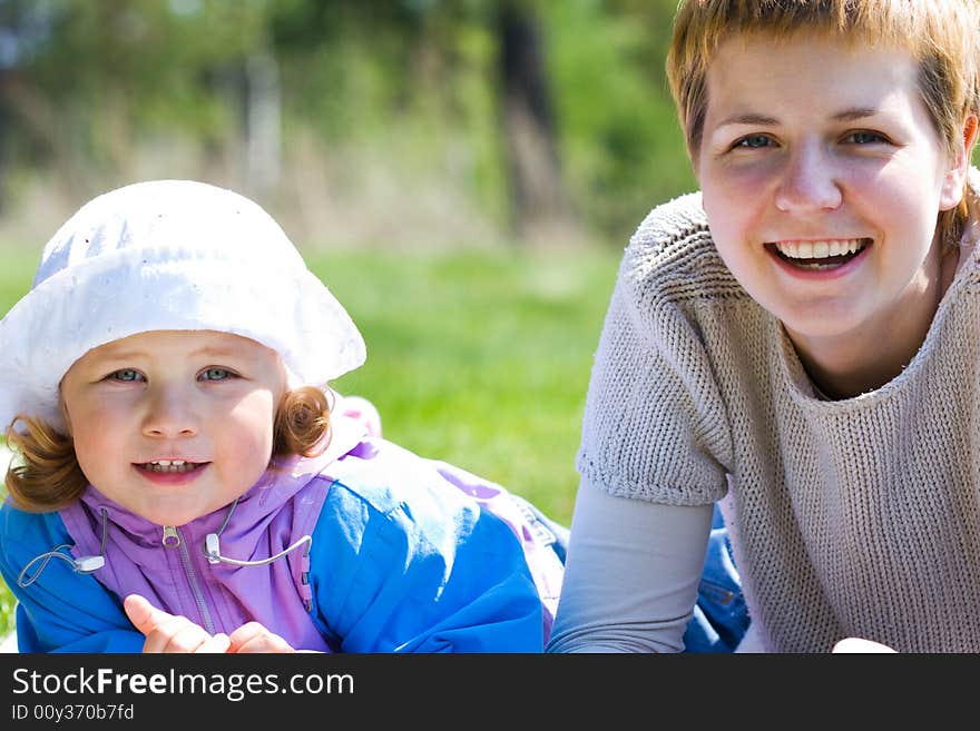 Mother and child outdoors, together and happy