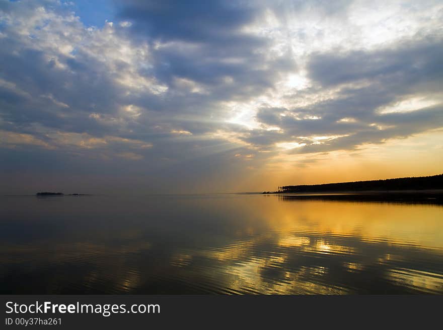 Sky, sea and forest coast on horizon. Sky, sea and forest coast on horizon