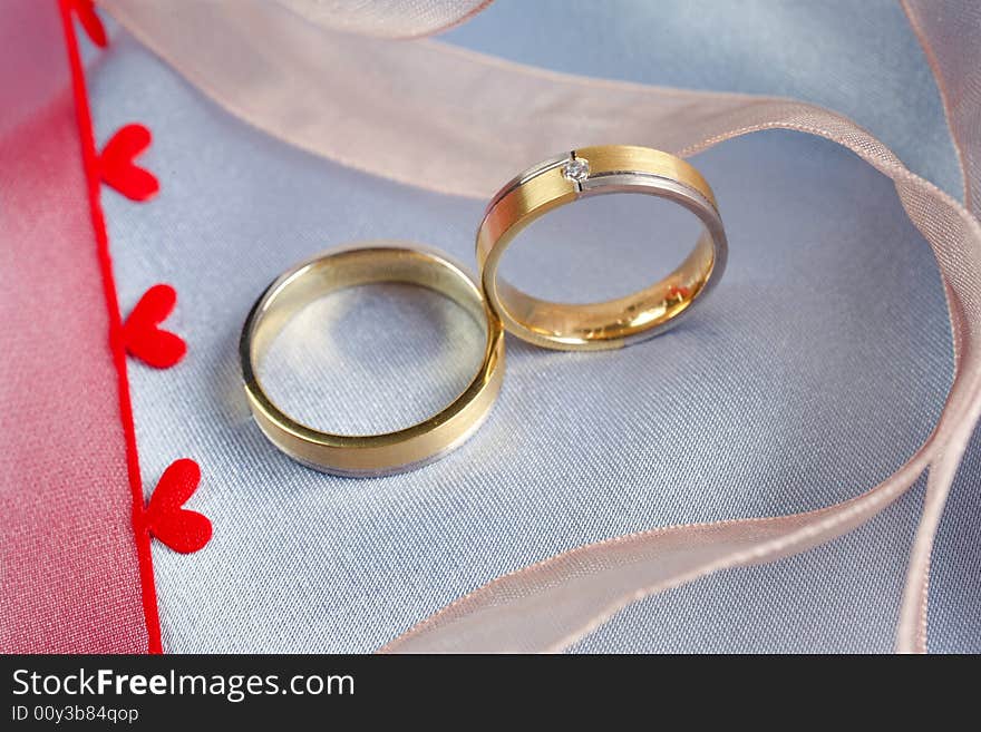 Wedding rings on a blue background