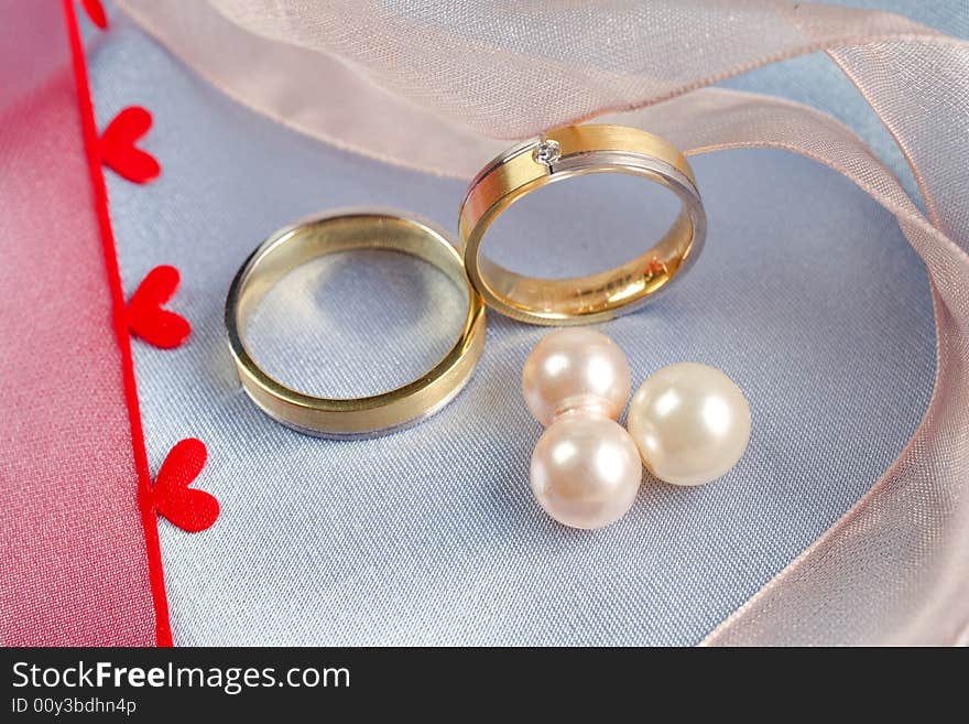 Wedding rings on a blue background