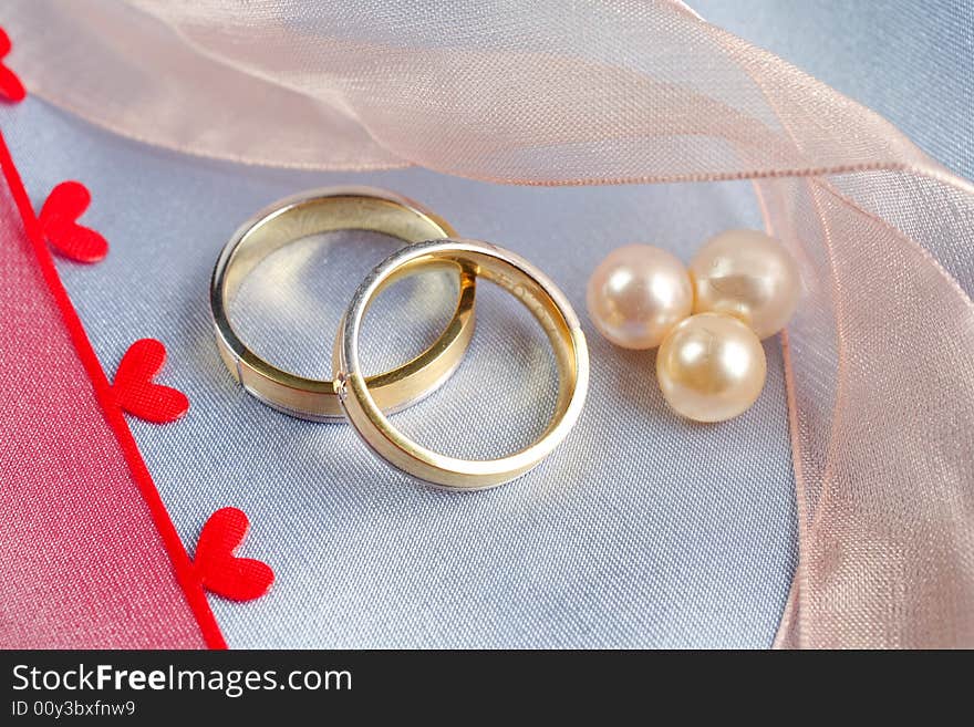 Wedding rings on a blue background