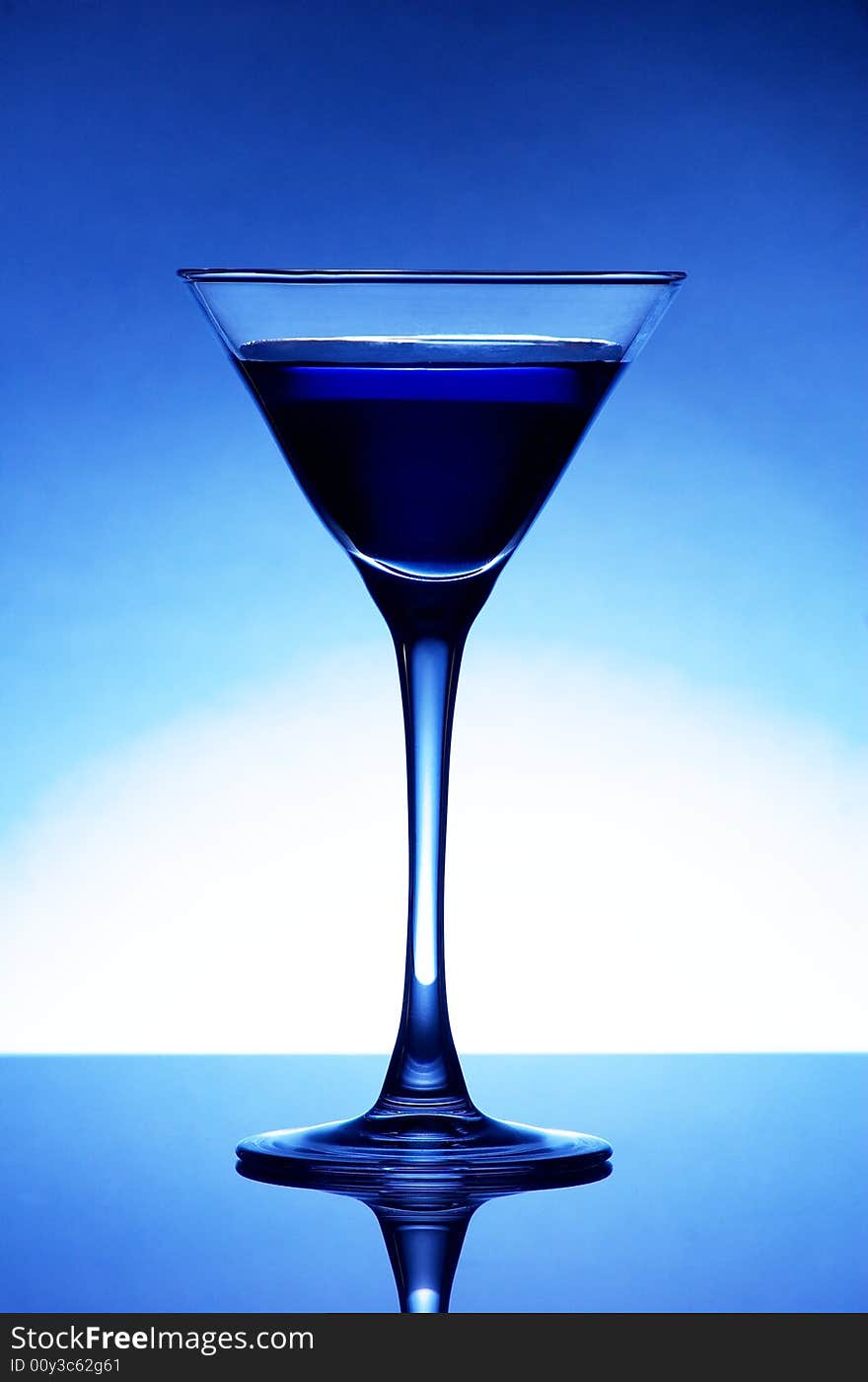 Martini glass with blue cocktail. Martini glass with blue cocktail