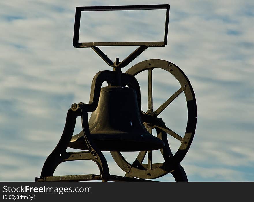 An old bell mounted on a store in Old Town San Diego, California. An old bell mounted on a store in Old Town San Diego, California