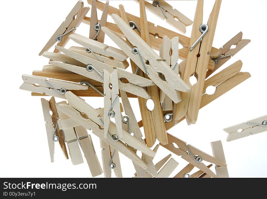 Pile of isolated wooden clothespins. Pile of isolated wooden clothespins