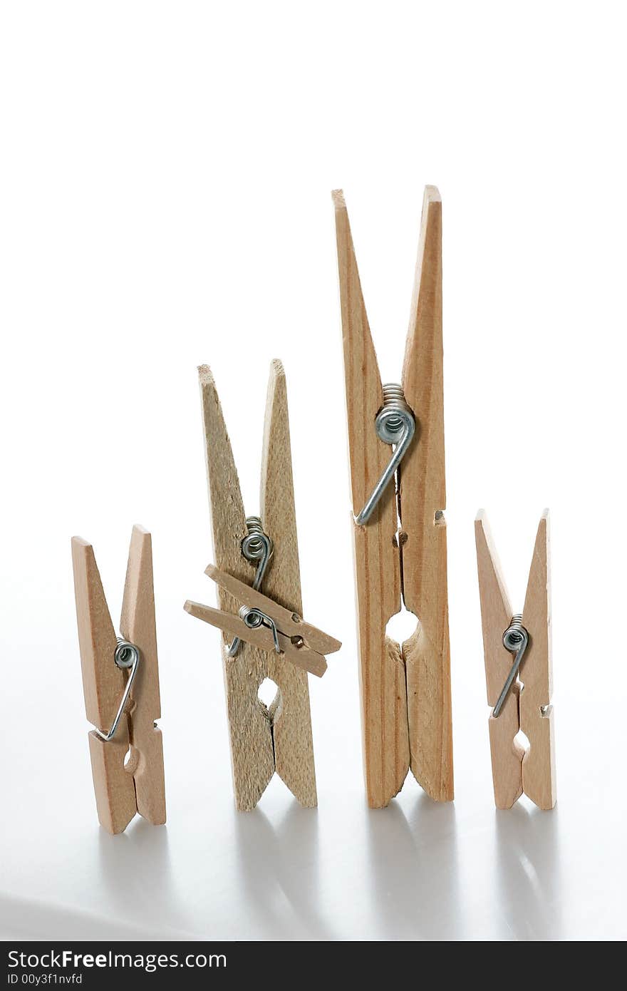 A wooden clothespin family (2 parents and 3 children). A wooden clothespin family (2 parents and 3 children)