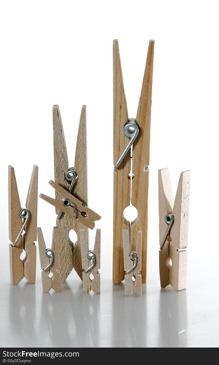 A wooden clothespin family (2 parents and 6 children). A wooden clothespin family (2 parents and 6 children)