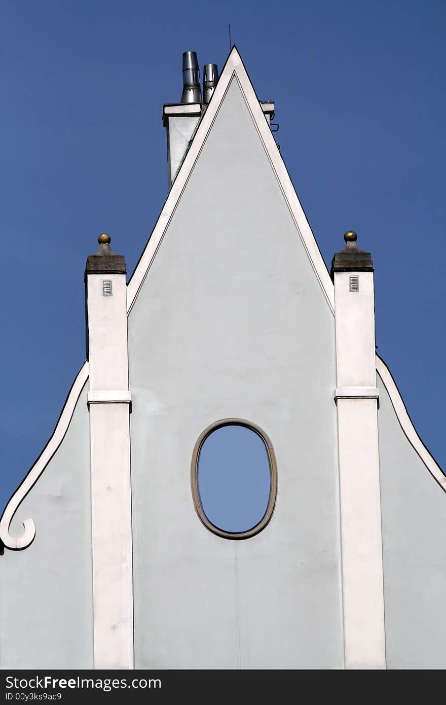 Top of the house over blue sky.