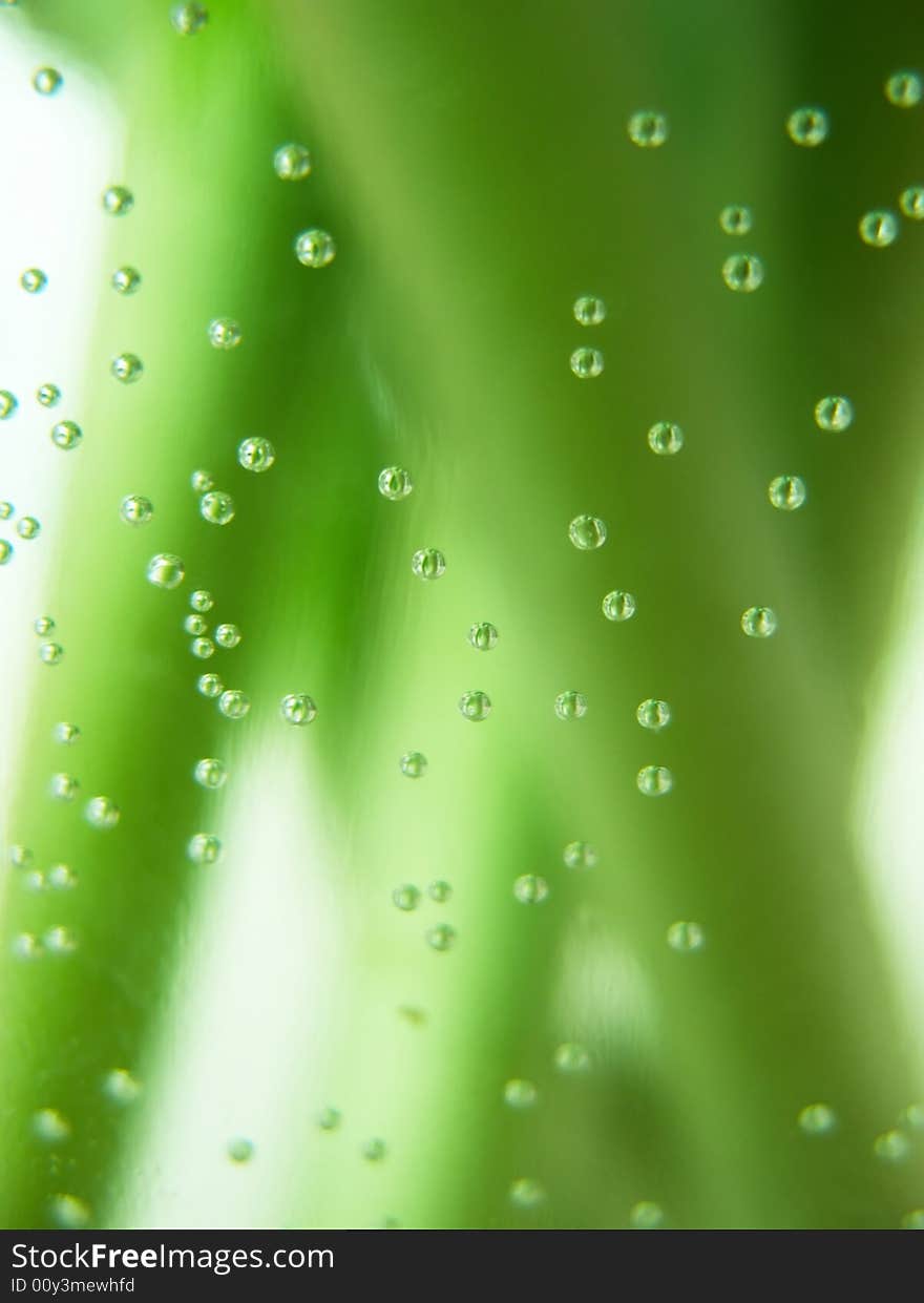 Water bubbles on green stalks background. Water bubbles on green stalks background