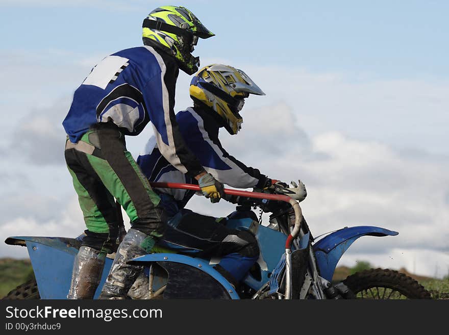 Two motorcyclists aspire to finish on road. Two motorcyclists aspire to finish on road