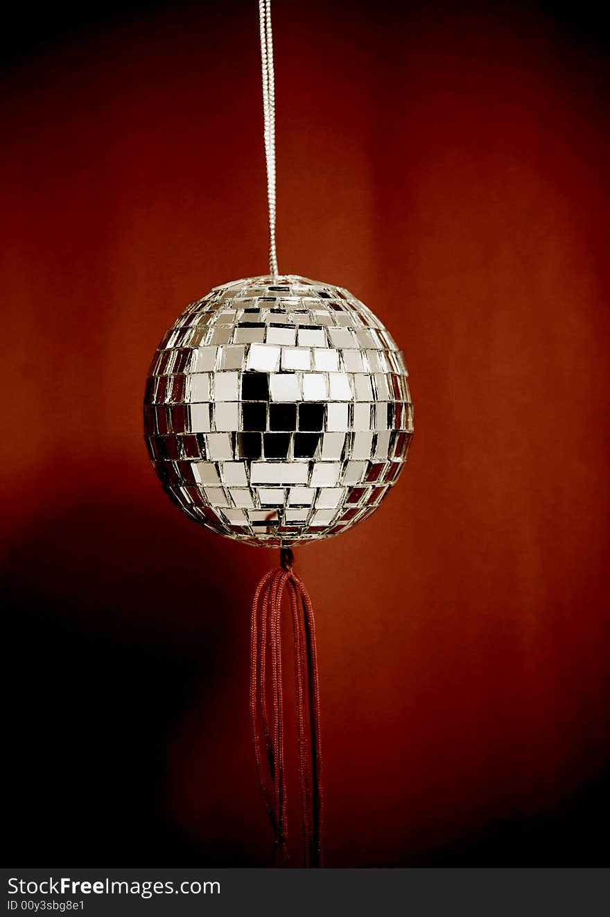 retro mirror ball with red background