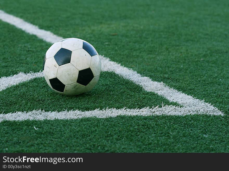 Football in stadium with an artificial covering before the beginning of game. Football in stadium with an artificial covering before the beginning of game.