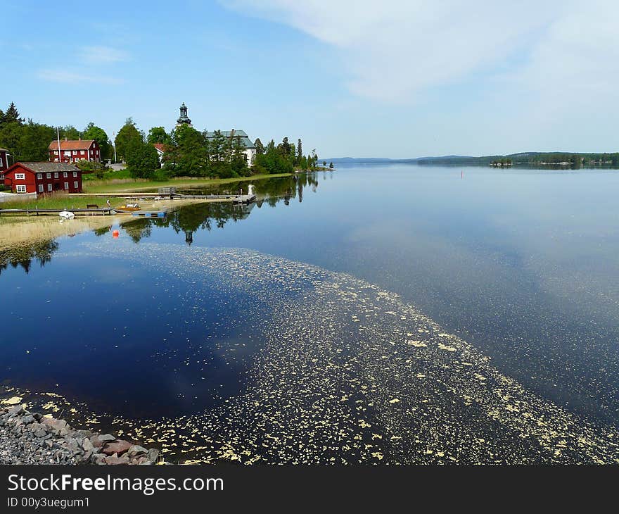 A swedish village by blue lake. A swedish village by blue lake.