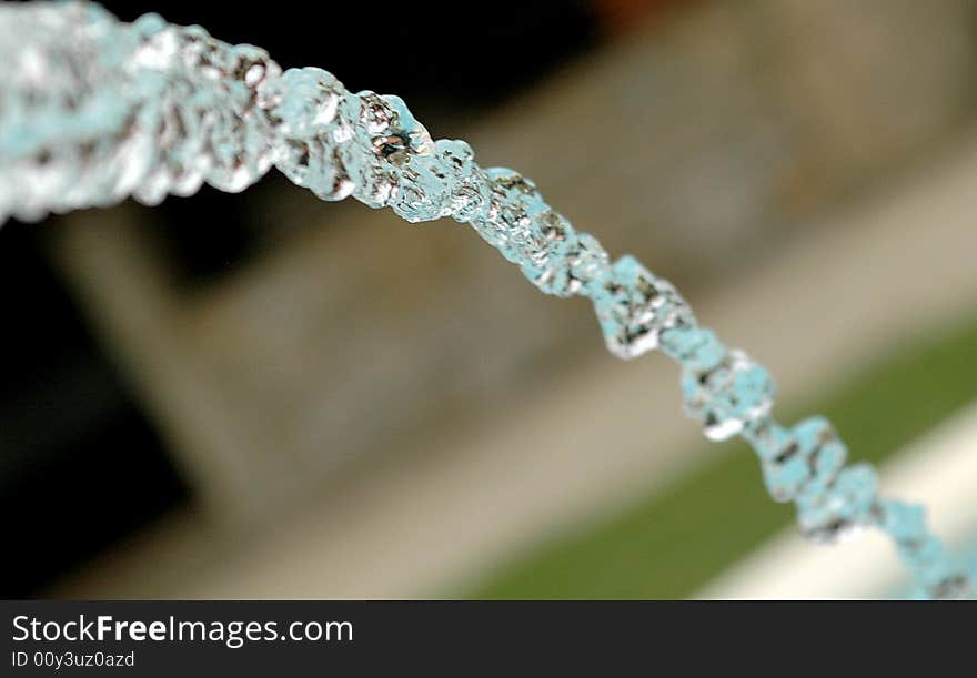 A stream of water running from a sculpture