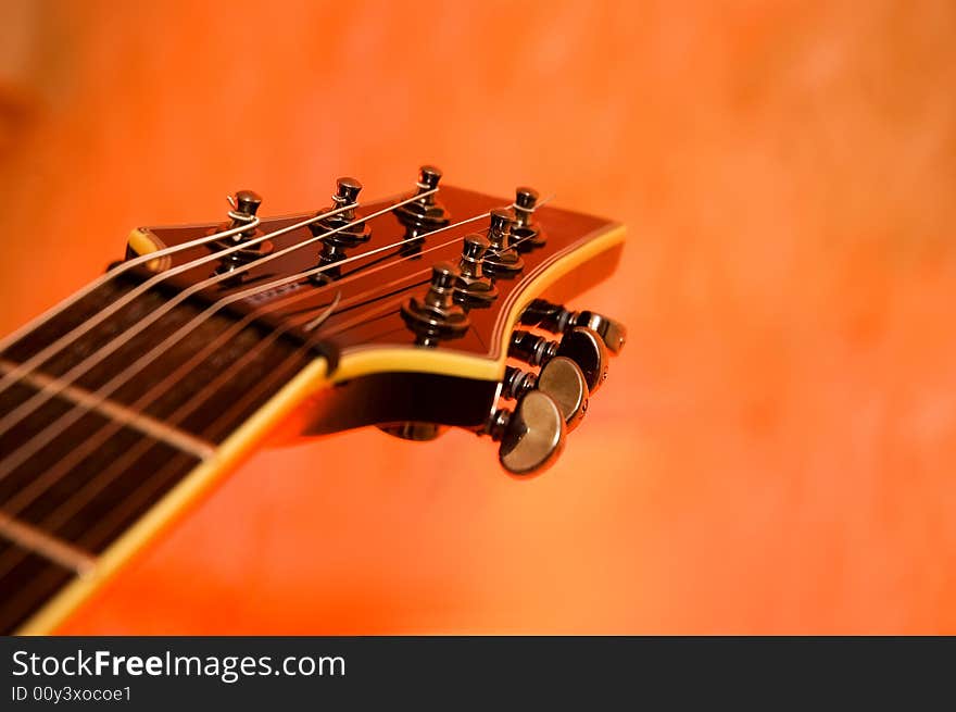 Close-up of the top of a black electric guitar