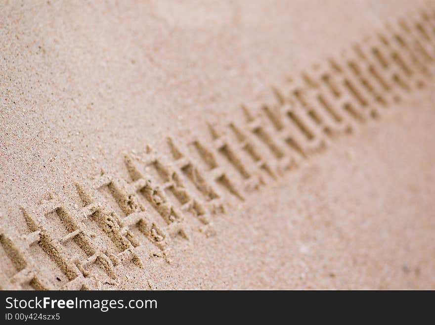 Motorbike track on the sand (shallow DOF). Motorbike track on the sand (shallow DOF)