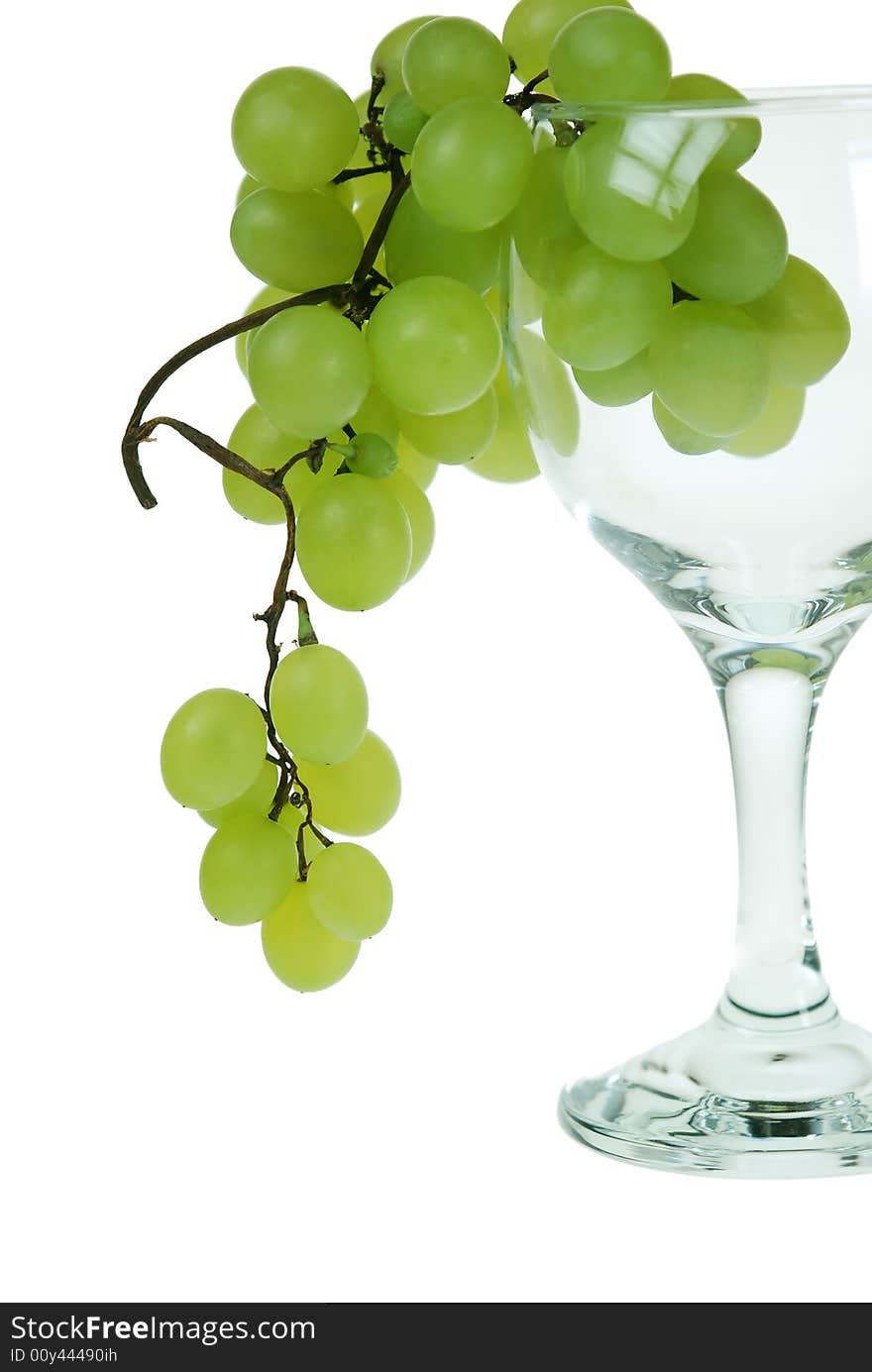 Green grapes in wine glass