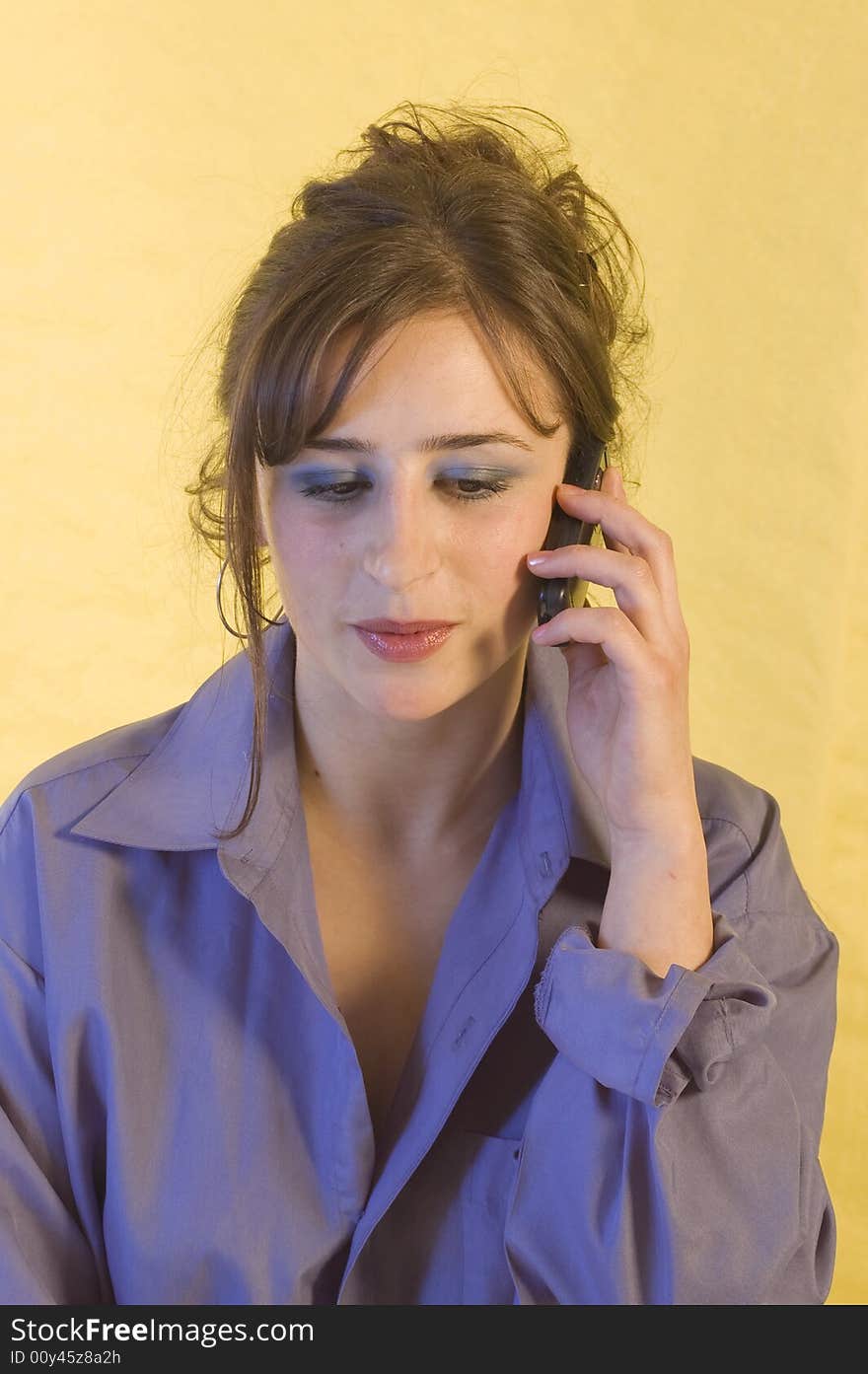 Young business woman making a mobile call