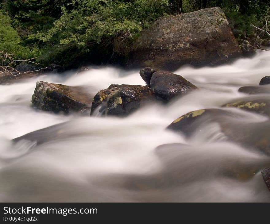 Rushing water in the North Fork of the Saint Vrain River - Rocky Mountain National Park. Rushing water in the North Fork of the Saint Vrain River - Rocky Mountain National Park