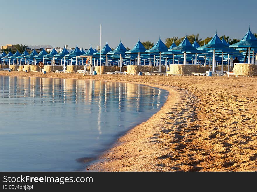 Beach And Parasols