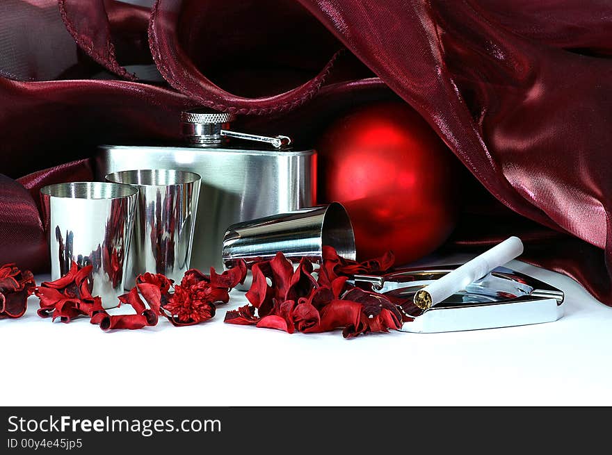 Still life in crimson tints with shpere, flask, still cups, colored dried plants, drapery and other objects. Still life in crimson tints with shpere, flask, still cups, colored dried plants, drapery and other objects