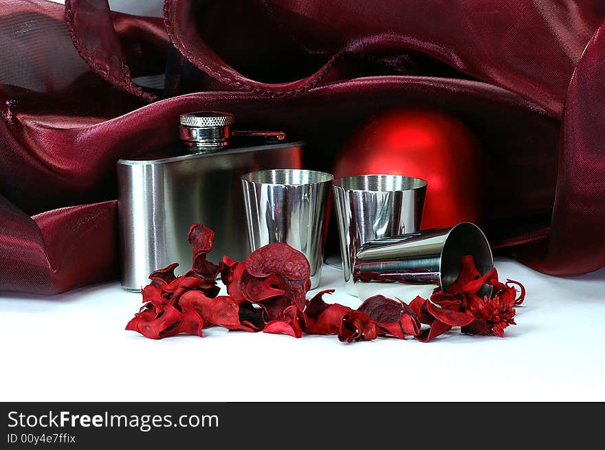 Still life in crimson tints with shpere, flask, still cups, colored dried plants, drapery and other objects. Still life in crimson tints with shpere, flask, still cups, colored dried plants, drapery and other objects