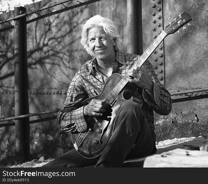 Guitar player with his instrument