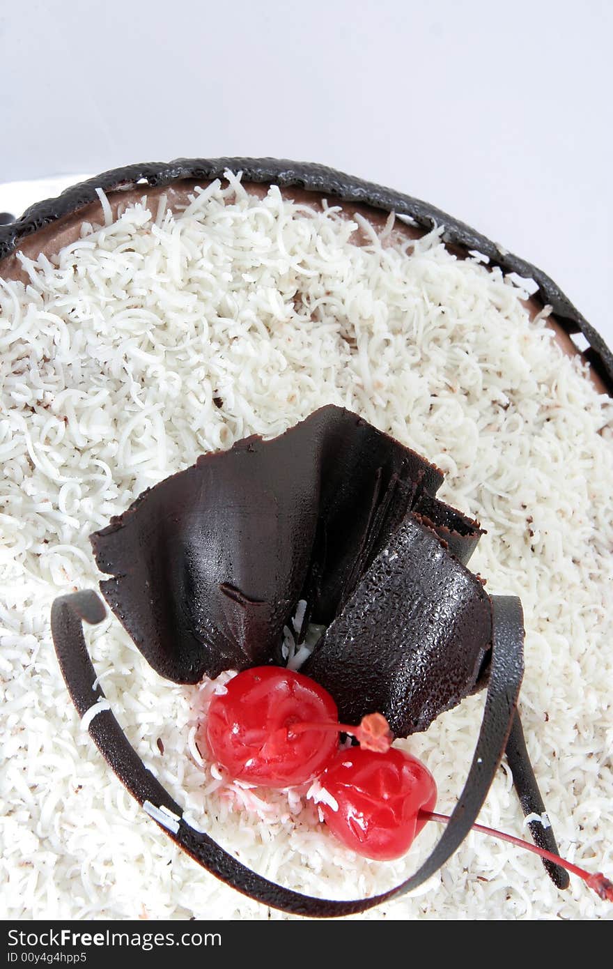 Chocolate cake with grated white chocolate on it