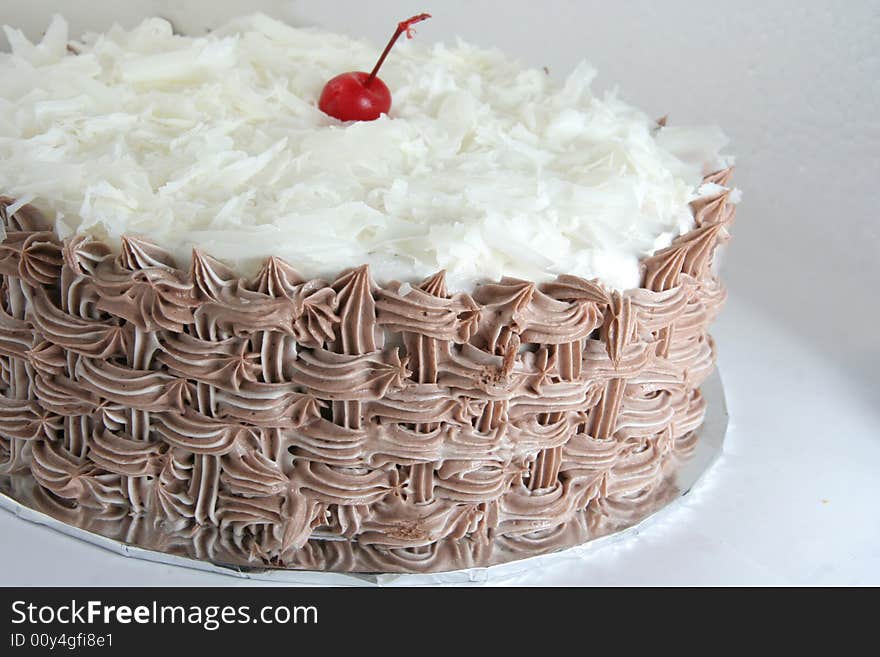 Chocolate cake with grated white chocolate on it