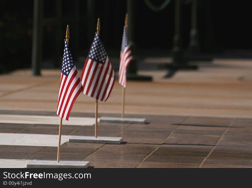 3 Flags of the United States lined up in a straight row