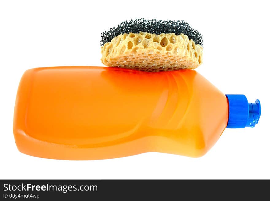 Detergent in orange plastic bottle and sponge on isolated background. Detergent in orange plastic bottle and sponge on isolated background