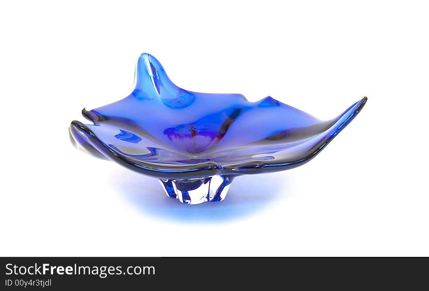 Blue glass ashtray close-up, isolated over white background