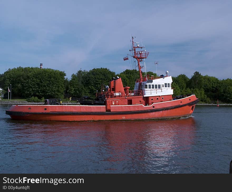 A huge tugboat in a harbor. A huge tugboat in a harbor