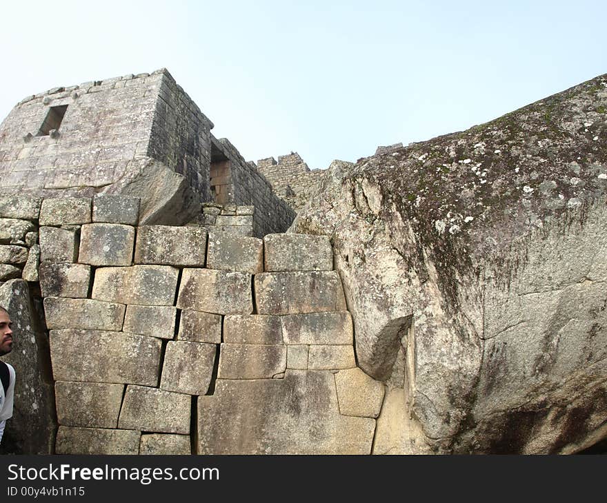 The lost city of the inca Machu Picchu in Cuzco, Peru. Inca window. inca window in the left.