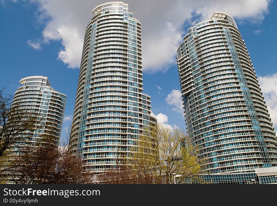 Wideangle shot of three modern residential towers in Toronto